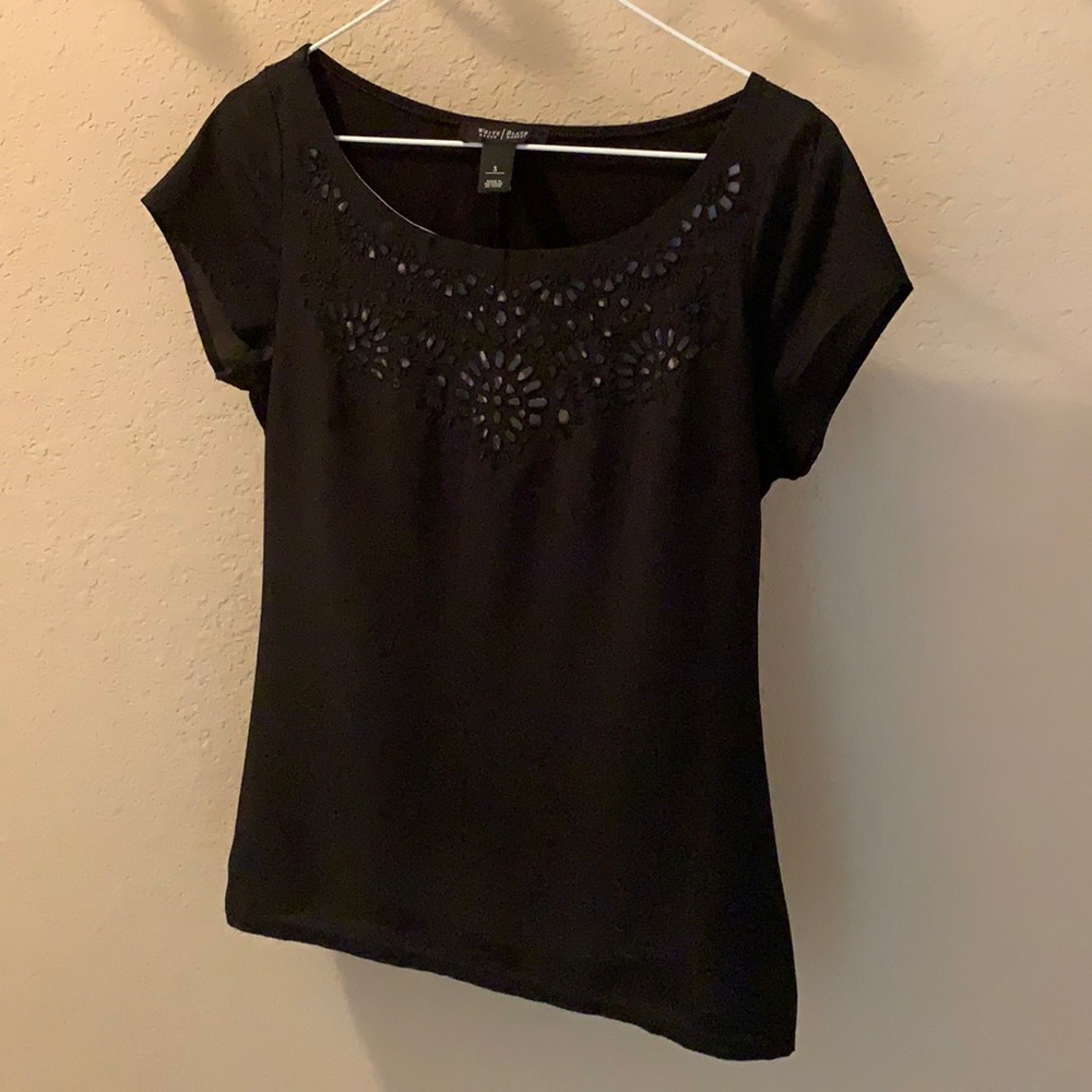 Women’s shirt sleeve dress shirt.